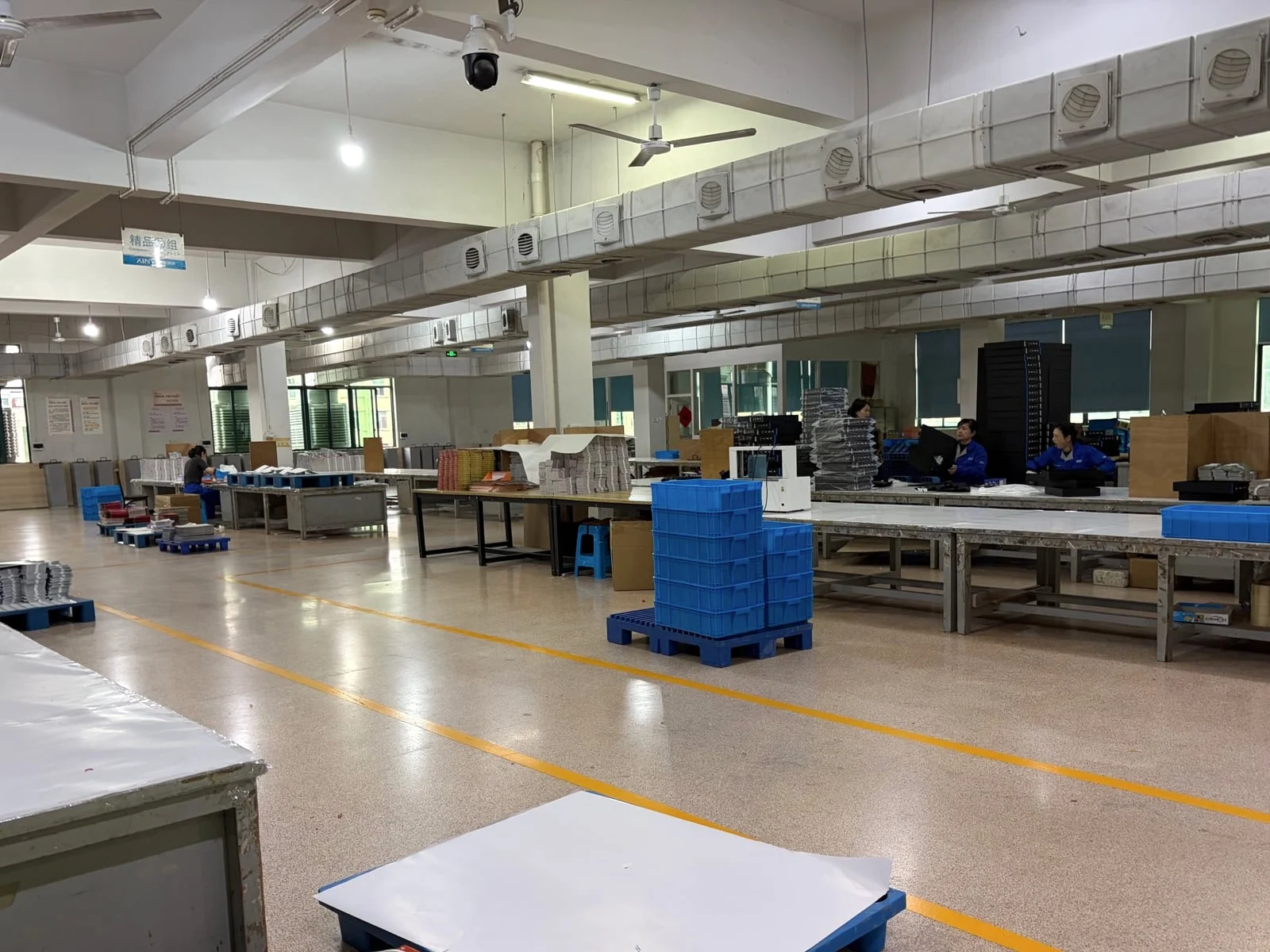 Organized production-control workstations in the JollyCracker factory