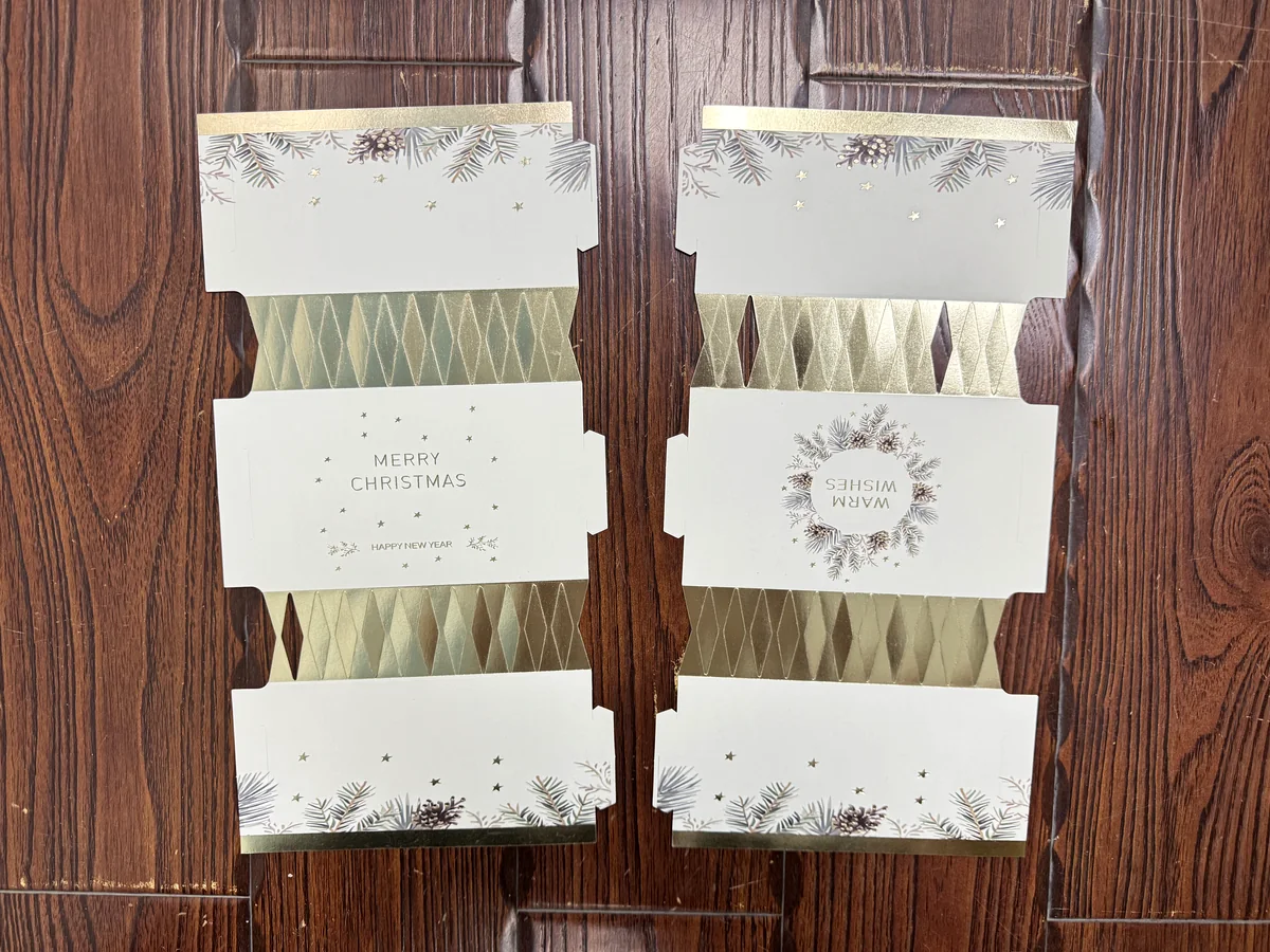 White kraft paper Christmas cracker print and finish options laid out for review