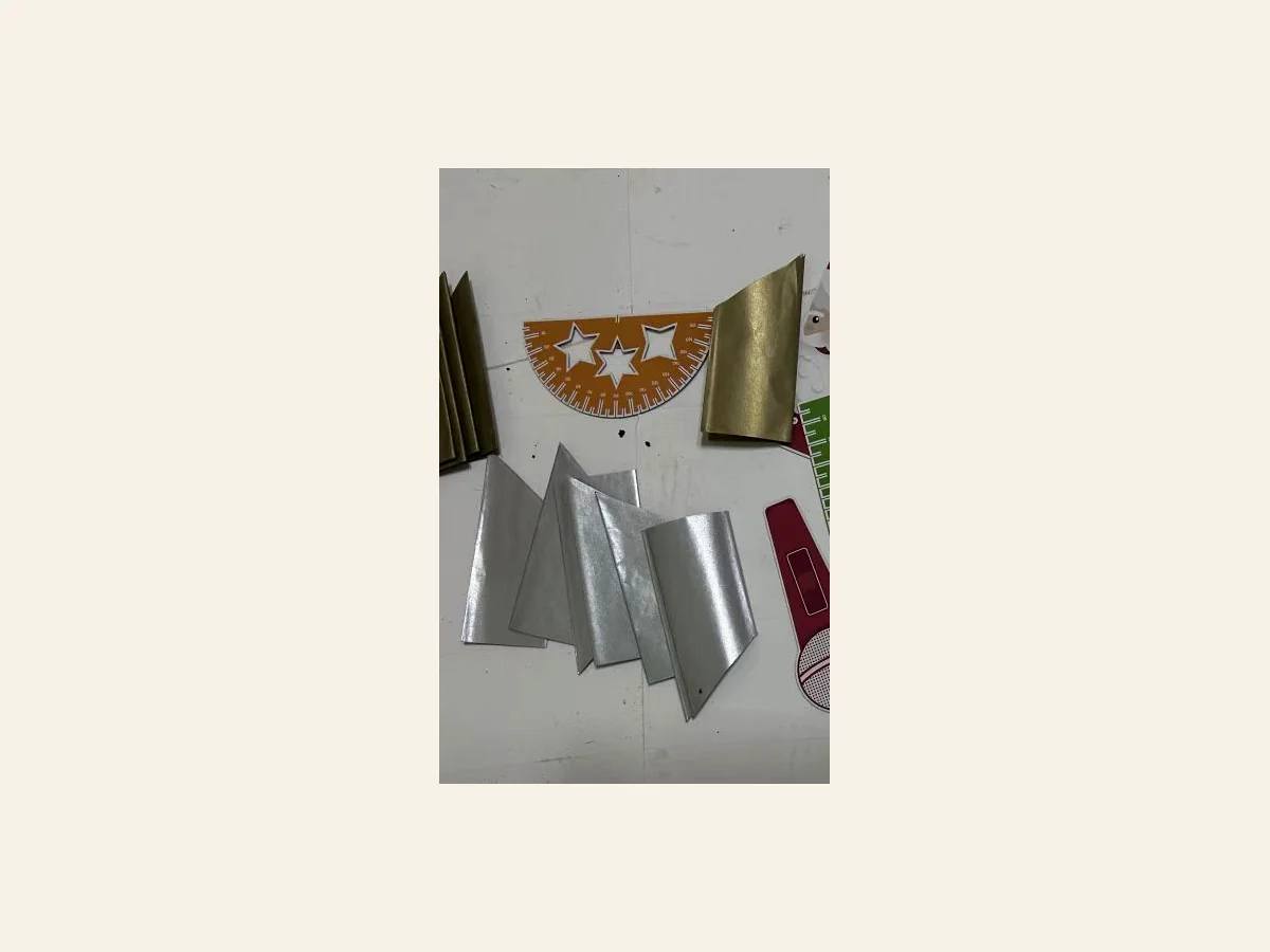 Gold and silver paper hats for premium Christmas crackers