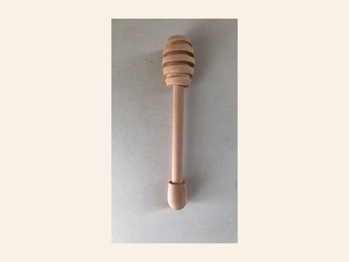 Small wooden honey dipper gift for a Christmas cracker