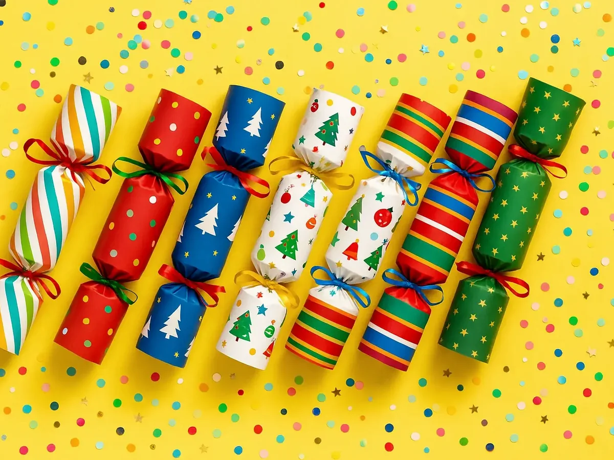 Colourful loose Christmas crackers arranged as a coordinated party range