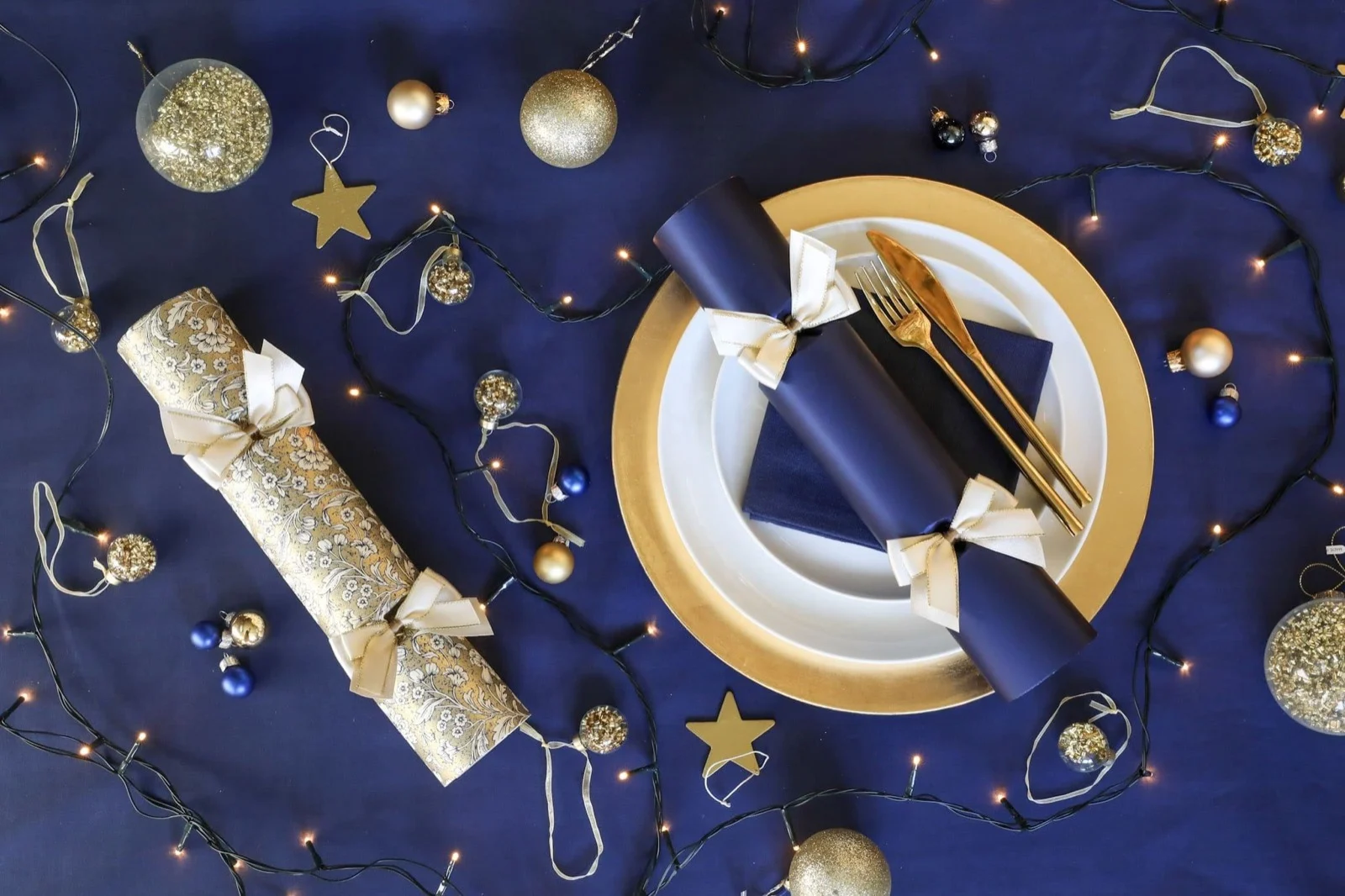 Luxury Christmas crackers arranged on an elegant festive dining table
