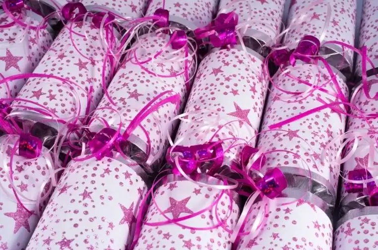Assortment of luxury and colorful Christmas crackers arranged on a festive party table, perfect for choosing the best style for a 2025 holiday celebration