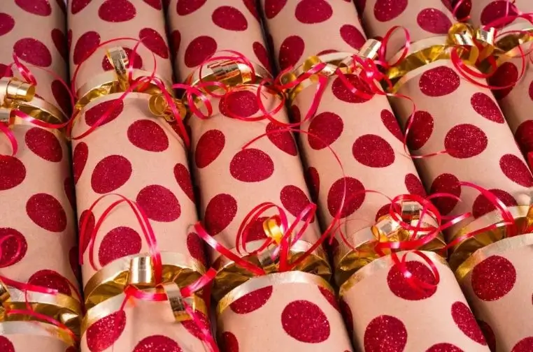 Festive retail store display with shelves of colorful luxury Christmas crackers, attracting holiday shoppers and boosting 2025 seasonal sales