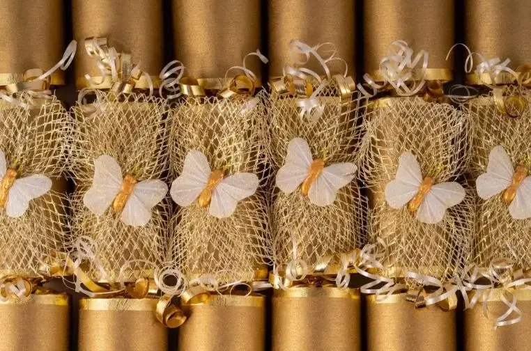 Close-up of beautifully designed luxury Christmas cracker packaging with premium ribbons and festive colors, highlighting the role of presentation in boosting 2025 holiday sales