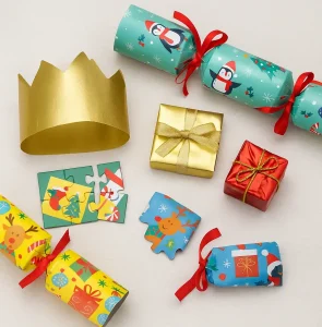 Party Christmas Crackers Customization Options Colorful party crackers with playful cartoon patterns, gold paper hat, puzzle toy, and festive packaging box on a white background